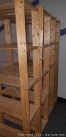 Set of four natural wood shelf units shown from angle displaying side and top shelves with visible knots and grain, taken to illustrate physical condition and dimensions.