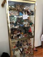 Front view of the metal display cabinet filled with stuffed animals (not included).