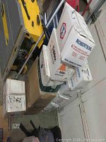 Stack of cardboard boxes containing screws