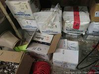 Overview of nine cardboard boxes labeled as Original Robertson screws, some open showing screws.