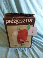 Front view of the original box showing the Preziosetta gnocchi maker illustration and branding.