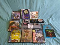 Photo showing all games and Gameboy Color system with Nintendo 64 cartridges, Super Nintendo cartridges, and GameCube games.