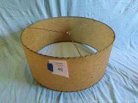 Full view of round mid century lampshade showing shape, size, and condition.