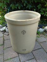 Full view of the 10 gallon off-white crock pot with logo and number 10 visible.