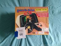 Front view of boxed Learn-To-Drive Highway Patrol battery operated dashboard toy showing main product image and key features.
