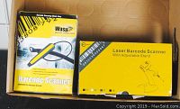 Two boxes showing the barcode scanners included: Wasp WWR2900 pen scanner and E-Sky laser scanner with an adjustable stand.
