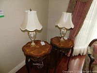 Both table lamps shown side by side on wooden inlay tables.