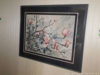 Full view of framed watercolor painting showing floral tree branch scene.