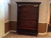 Front view of full bookcase showing overall design, shelves and feet