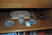 Wood trays and ceramic items shown on wooden surface including signed ceramics 'Ioska Denmark 73'