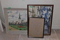 Three framed pieces including signed painting, landscape painting, and empty frame