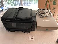 Overview image showing Epson WF3520 printer and HP ScanJet 5200C scanner side by side on table with cables attached.