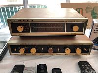 Front view of Bell tuner (top) and tube amplifier (bottom) showing selector, tuning and tone controls