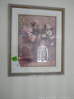 Framed art print showing floral bouquet in urn with pink and white flowers, silver ornate frame with matte.