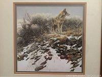 Full view of framed wolf print showing entire artwork and frame.