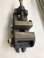 Side angle view showing the threaded screw handle and fixed jaw with 'BRON' stamped.