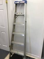 Front view of the 6-foot Lite aluminum step ladder showing five steps and blue top label.