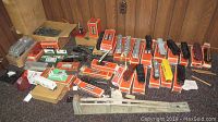 Wide view of assorted boxed accessories, track sections and engines