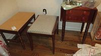 View of the drop leaf table and two benches, showing the unfinished top bench and the upholstered bench.