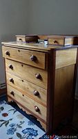 Front and side view of the antique wooden dresser showing hand dovetailed drawer joints and acorn wooden drawer pulls.