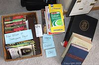 Overview photo showing basket with Folger Editions Shakespeare plays, travel books on France, England, Italy, Bibles, and the Family of Man book.