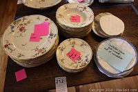 Overall view of the 30-piece Castleton Sunnyvale dishware set arranged on a table labeled with quantity and item type.