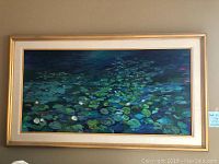 Full view of painting in gold-tone frame with linen mat