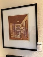 Framed monoprint etching hung on wall showing detailed composition of an interior with a dog.