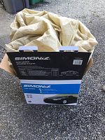 Simoniz medium car cover packaging and folded cover on the ground