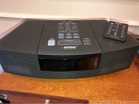 Front view of radio/CD unit with remote control placed on top right