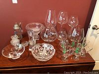Entire lot arranged on table showing all glassware, crystal, silver items
