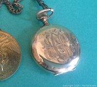 Monogram-engraved front cover of gold-filled pocket watch case