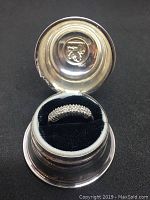 Open Birks Regency plated ring box with white gold diamond ring inside