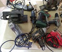 Overview of all power tools showing multiple saws, sanders, and drills.
