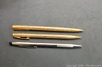 Three pens laid side by side showing full barrel length and profile