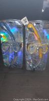 Two Body Glove snorkeling sets in original blister packaging; one with blue mask and snorkel, the other yellow.