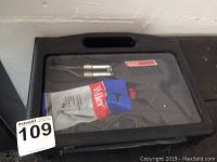 Photo of Weller soldering iron kit in black plastic carrying case, includes solder spool.