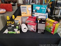 Full view of assortment of light bulbs and accessories on table