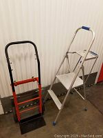 Photo showing both the folding step ladder (right) and adjustable dolly (left) side by side.