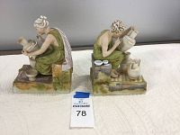 Front view of two porcelain Grecian lady bookends showing detailed sculpting and coloring