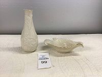 Two Lenox porcelain items on a quilted surface, showing full shapes and details