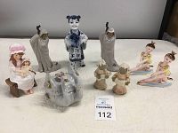 Overview of all ceramic figurines including children, ballerinas, swans, and cloaked figures