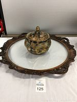 Photo showing the round wood carved tray with glass bottom and the hexagonal Satsuma dish with lid placed on it.