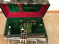 Cornet body partially removed from case showing overall instrument and case exterior