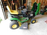 Side view of mower with deck and seat