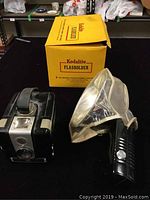 Kodalite flash holder with Bakelite handle, reflector diffuser, and original Kodalite box.
