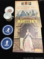 Overview of lot showing magazine, newspaper supplement, Wedgwood plates, and porcelain cup/saucer