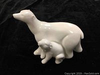 Front-side view of white porcelain polar bear figurine showing mother and cub with no visible damage.