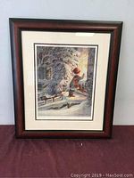 Framed print with wood-tone frame and white mat on burgundy cloth background