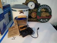 Margaritaville Chillin Pour machine with accessories, Guinness and Moosehead signs in background